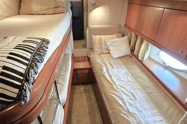 Slide: The Image of Luxurious cabin interior of 2005 Sunseeker Manhattan 66 yacht with cozy twin beds. - 59