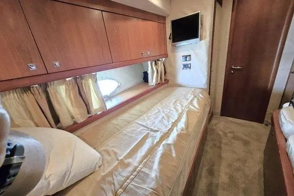 Slide: The Image of Luxurious cabin interior of 2005 Sunseeker Manhattan 66 yacht with cozy bedding. - 60