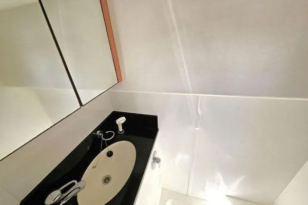 Slide: The Image of Bathroom interior of 2005 Sunseeker Manhattan 66 yacht with sleek sink and mirror. - 66