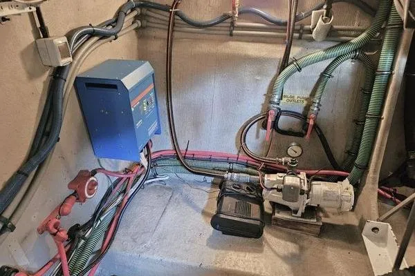 Slide: The Image of Engine room of 2005 Sunseeker Manhattan 66 yacht with electrical and plumbing systems. - 70