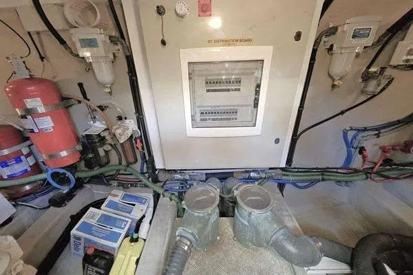 Slide: The Image of Engine room of 2005 Sunseeker Manhattan 66 yacht with control panel and equipment. - 74