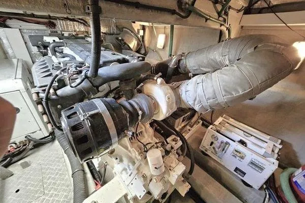 Slide: The Image of Engine room of a 2005 Sunseeker Manhattan 66 yacht, showcasing mechanical components. - 77