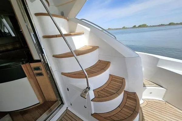 Slide: The Image of Staircase on 2005 Sunseeker Manhattan 66 yacht with wooden steps and ocean view. - 9