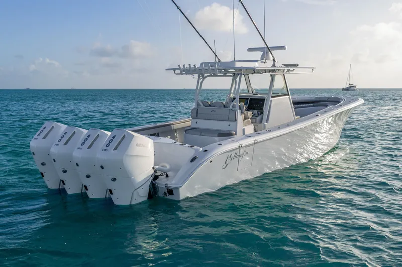 Slide: The Image of 2024 Yellowfin 39 Offshore boat with triple engines on open water. - 11