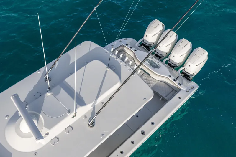 Slide: The Image of 2024 Yellowfin 39 Offshore boat with four powerful outboard engines on blue ocean water. - 15