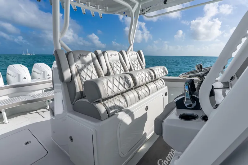 Slide: The Image of 2024 Yellowfin 39 Offshore boat interior with luxurious seating and ocean view. - 18