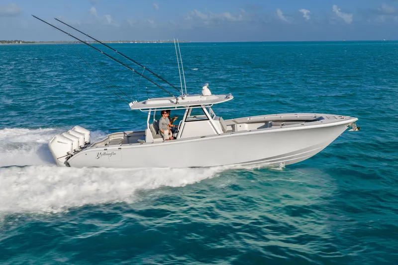 Slide: The Image of 2024 Yellowfin 39 Offshore boat cruising on open blue water. - 2