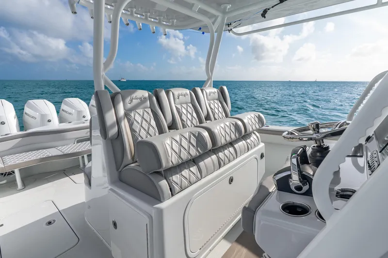 Slide: The Image of 2024 Yellowfin 39 Offshore boat interior with luxurious seating and ocean view. - 20