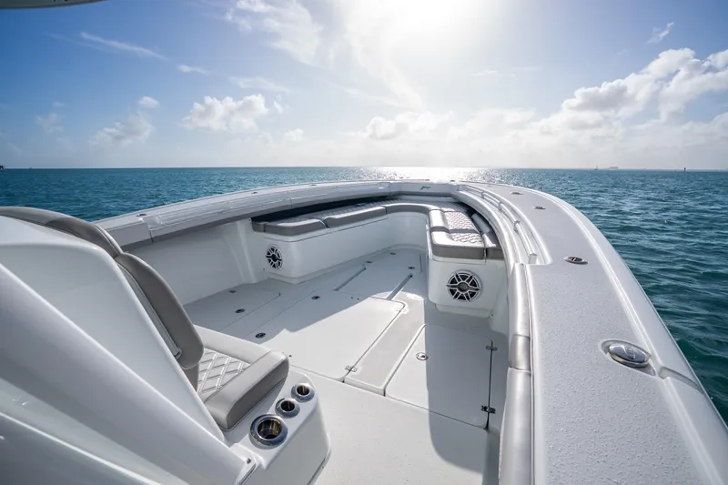 Slide: The Image of 2024 Yellowfin 39 Offshore boat interior with ocean view, featuring spacious seating and modern design. - 21