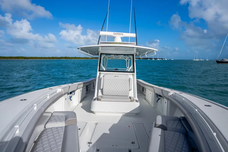 Slide: The Image of 2024 Yellowfin 39 Offshore boat on blue ocean under clear sky. - 25