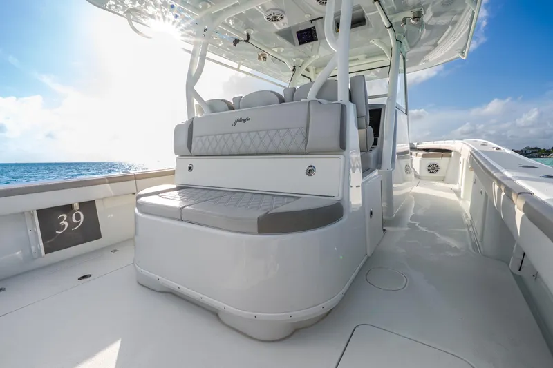 Slide: The Image of 2024 Yellowfin 39 Offshore boat interior with luxurious seating and ocean view. - 31