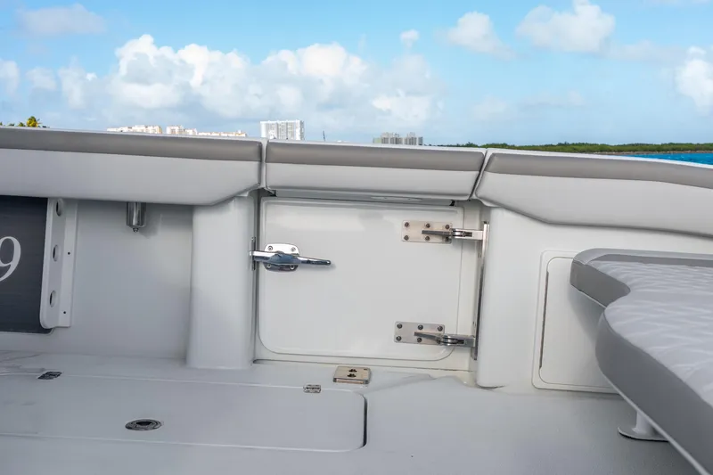 Slide: The Image of 2024 Yellowfin 39 Offshore boat interior with storage compartment and seating. - 36