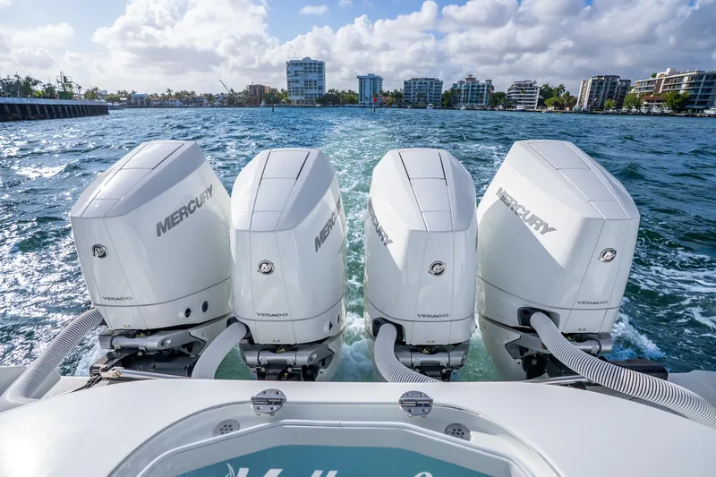 Slide: The Image of 2024 Yellowfin 39 Offshore boat with four Mercury Verado engines cruising on water. - 40