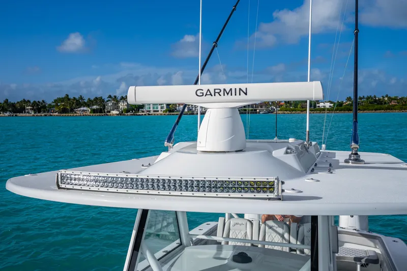 Slide: The Image of 2024 Yellowfin 39 Offshore boat with Garmin radar on turquoise water. - 41