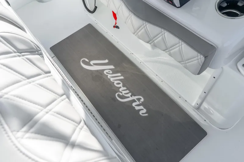 Slide: The Image of 2024 Yellowfin 39 Offshore boat interior with branded flooring and quilted seating. - 43