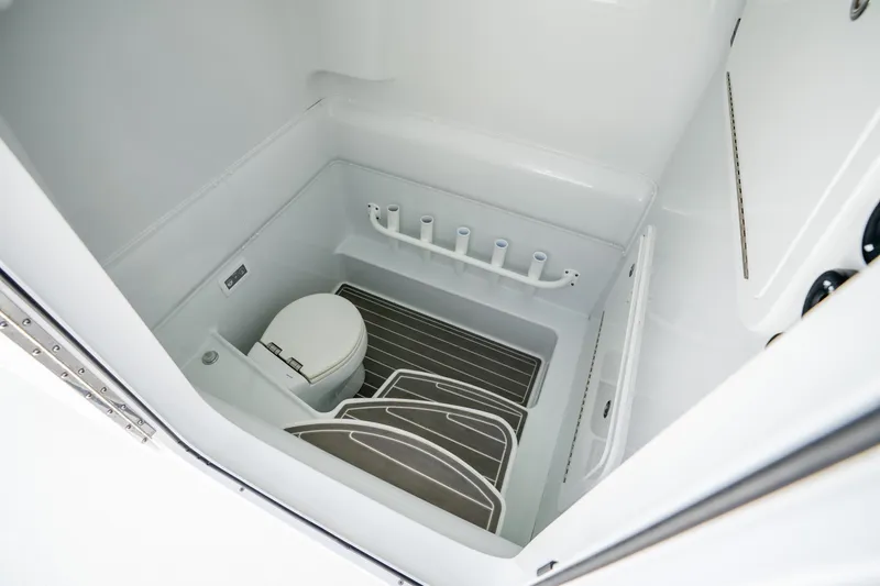 Slide: The Image of 2024 Yellowfin 39 Offshore boat interior with toilet and rod holders. - 44