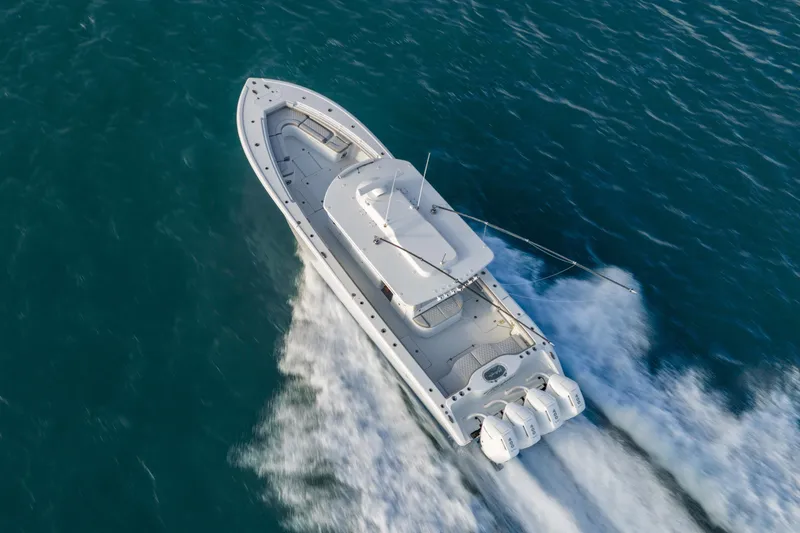 Slide: The Image of 2024 Yellowfin 39 Offshore boat cruising on open water, aerial view. - 6