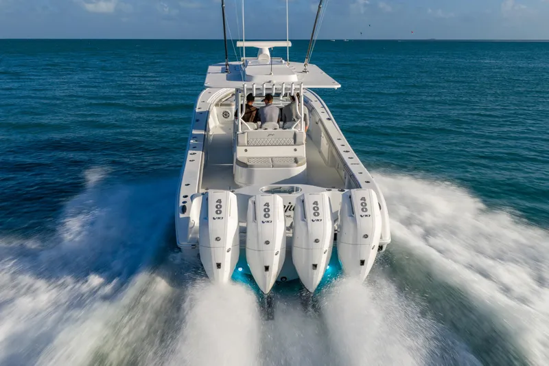 Slide: The Image of 2024 Yellowfin 39 Offshore boat cruising on open water with powerful engines. - 8