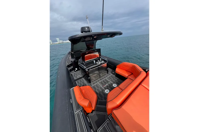 Slide: The Image of Luxury MV Marine 40 boat, 2017 model, with sleek design and vibrant orange seating. - 13