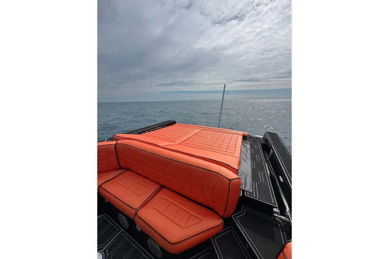 Slide: The Image of Luxurious MV Marine 40 boat with orange seating, 2017 model, on a serene ocean backdrop. - 18