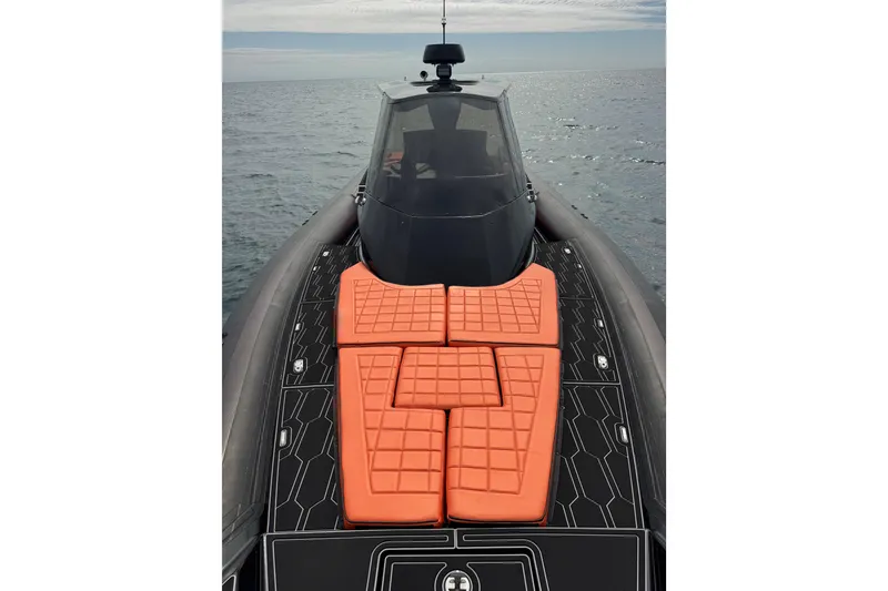 Slide: The Image of MV Marine 40 boat, 2017 model, with orange cushions on deck, cruising on open water. - 21