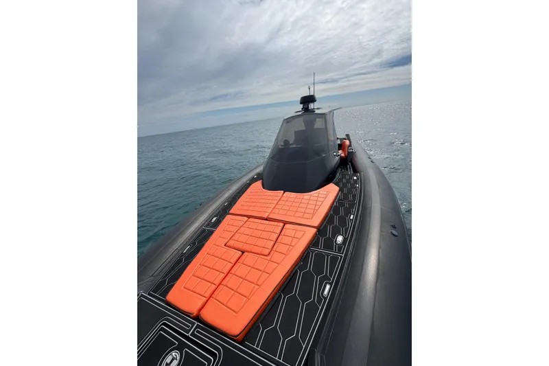 Slide: The Image of MV Marine 40 boat, 2017 model, with orange deck cushions on open sea. - 22
