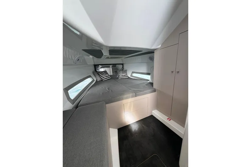 Slide: The Image of Interior cabin of 2017 MV Marine 40 boat with bed and storage cabinets. - 24