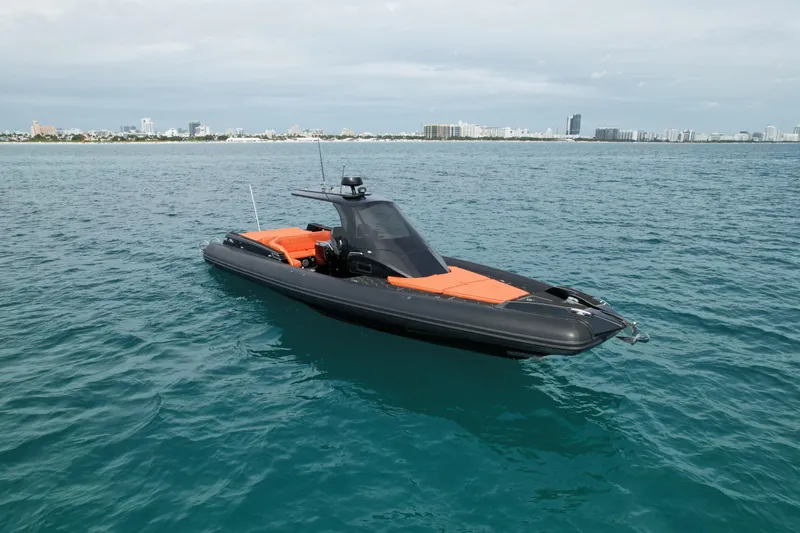 Slide: The Image of 2017 MV Marine 40 boat with orange seating on calm ocean waters. - 4