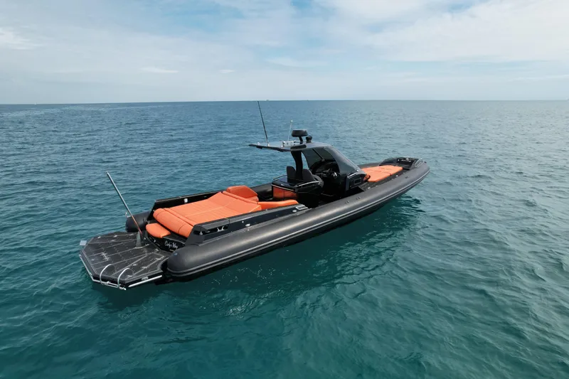 Slide: The Image of 2017 MV Marine 40 boat with orange seating on calm ocean waters. - 6