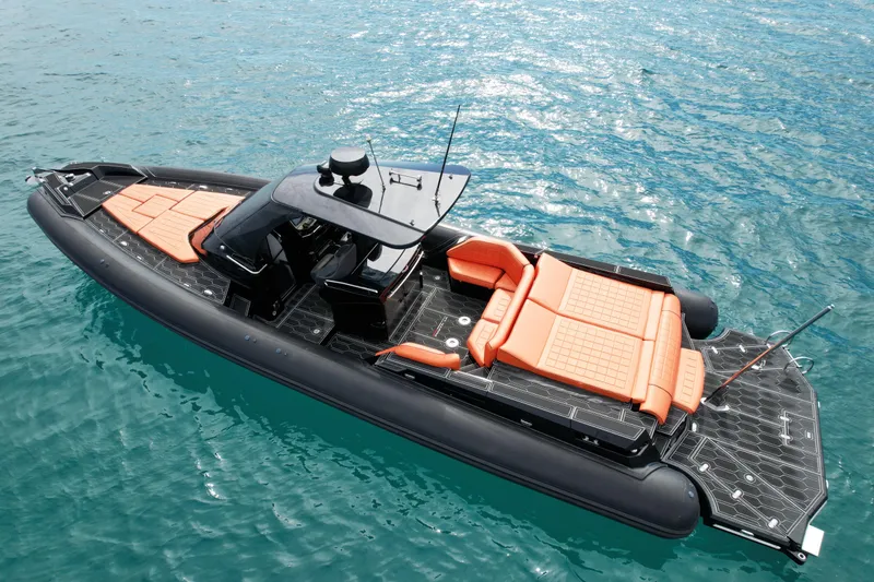 Slide: The Image of 2017 MV Marine 40 boat with orange seating on blue water. - 9