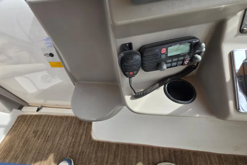 Slide: The Image of 2002 Cruisers Yachts 3372 Express cockpit with radio and control panel. - 13