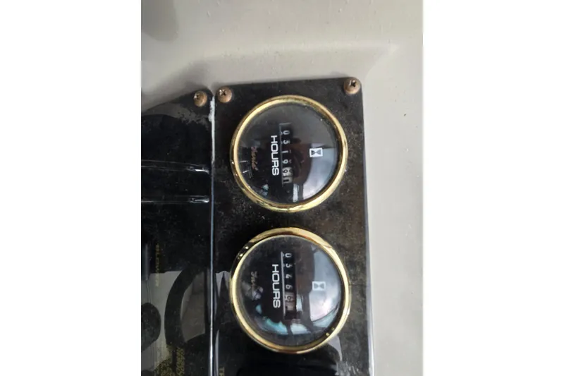 Slide: The Image of Close-up of hour meters on a 2002 Cruisers Yachts 3372 Express dashboard. - 15