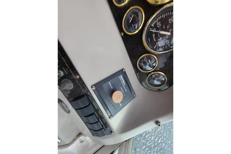Slide: The Image of Dashboard of a 2002 Cruisers Yachts 3372 Express with gauges and controls. - 16