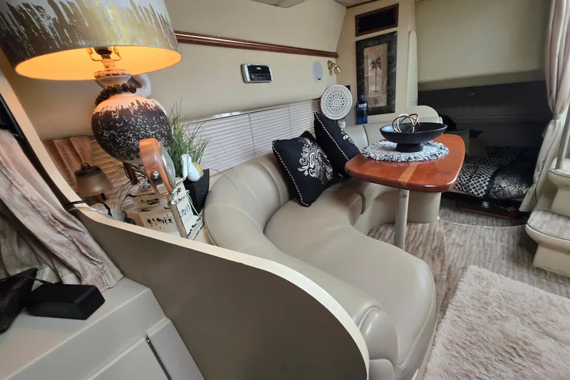Slide: The Image of Luxurious interior of 2002 Cruisers Yachts 3372 Express with elegant decor and cozy seating. - 26