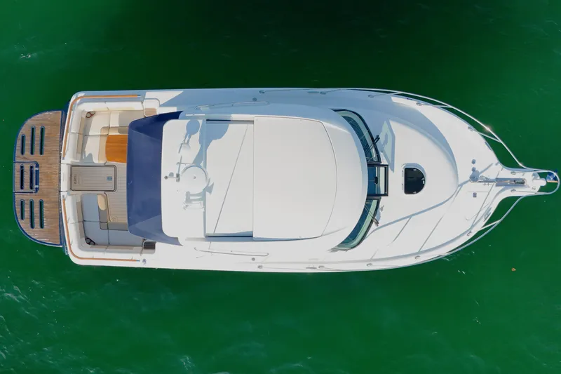 Slide: The Image of Aerial view of 2014 Tiara Yachts 3100 Coronet on green water. - 12