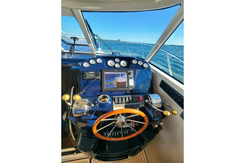 Slide: The Image of 2014 Tiara Yachts 3100 Coronet helm with navigation system and ocean view. - 13