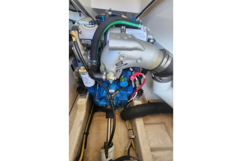 Slide: The Image of Engine compartment of a 2014 Tiara Yachts 3100 Coronet, showcasing mechanical components. - 23