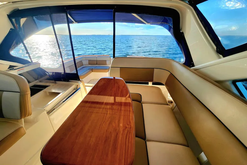 Slide: The Image of Interior of 2014 Tiara Yachts 3100 Coronet with ocean view and elegant seating. - 6