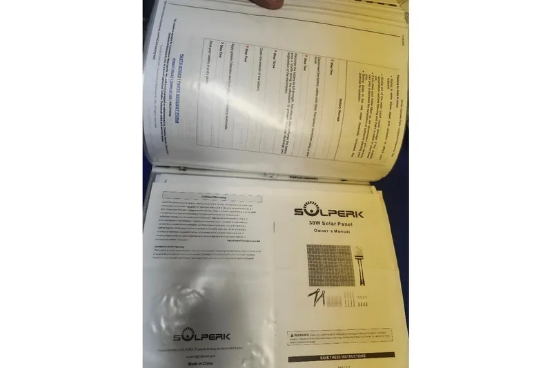 Slide: The Image of Solperk 30W solar panel owner's manual with warranty details, Precision 165, 1996. - 17