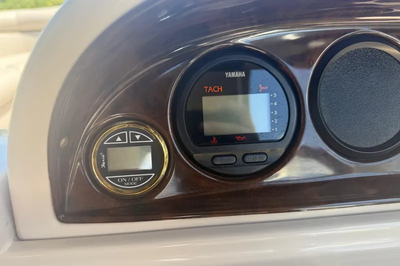 Slide: The Image of Dashboard of a 2003 Godfrey 2200 RE boat with Yamaha tachometer. - 27