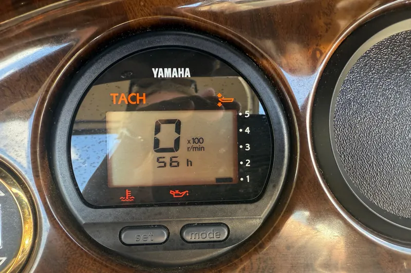 Slide: The Image of Yamaha tachometer displaying 0 RPM and 56 hours on a 2003 Godfrey 2200 RE. - 28