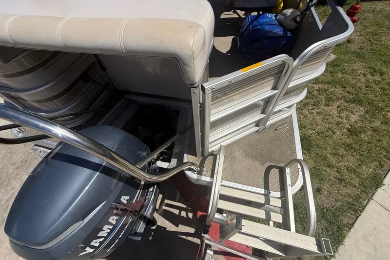 Slide: The Image of 2003 Godfrey 2200 RE boat with Yamaha engine and boarding ladder. - 38