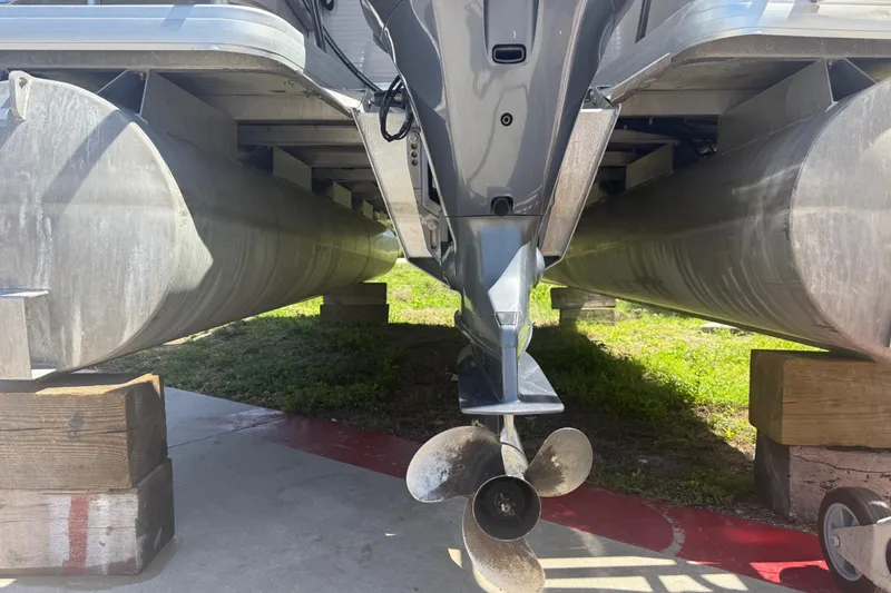 Slide: The Image of Underneath view of a 2003 Godfrey 2200 RE pontoon boat on blocks. - 39