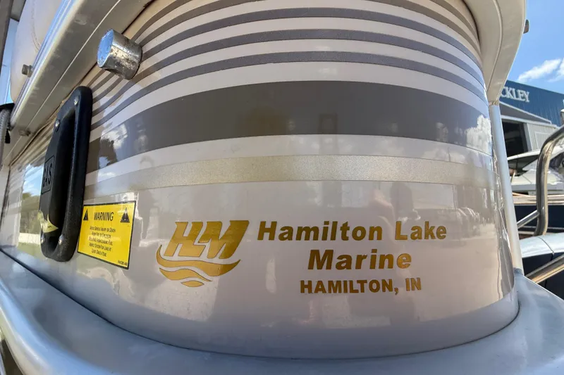 Slide: The Image of Close-up of a 2003 Godfrey 2200 RE boat with Hamilton Lake Marine branding. - 5