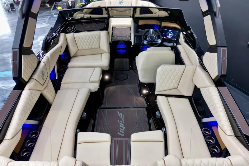 Slide: The Image of Luxurious interior of 2026 Tigé Z3 boat with modern dashboard and plush seating. - 10