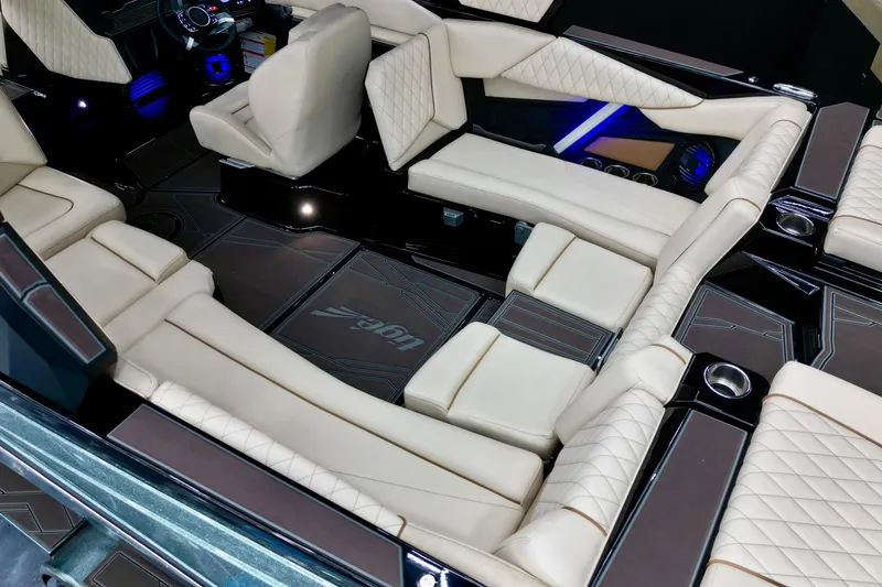 Slide: The Image of Luxurious interior of 2026 Tigé Z3 boat with plush seating and modern dashboard. - 11
