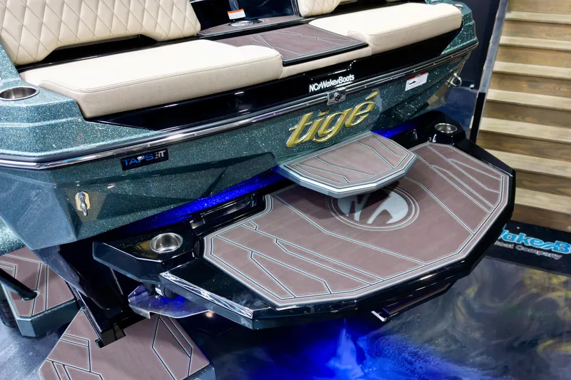 Slide: The Image of 2026 Tigé Z3 boat with stylish swim platform and steps, featuring sleek design elements. - 15