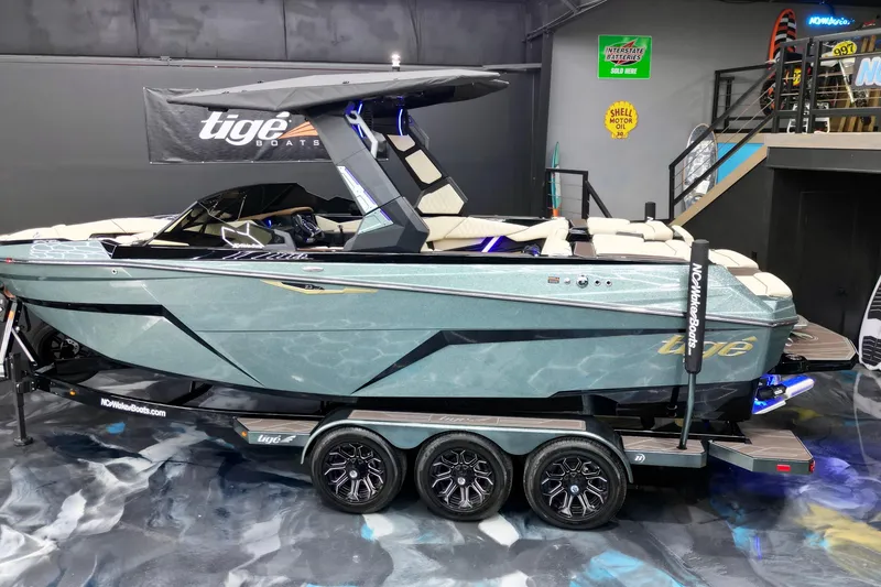 Slide: The Image of 2026 Tigé Z3 boat on display in showroom with sleek design and modern features. - 2