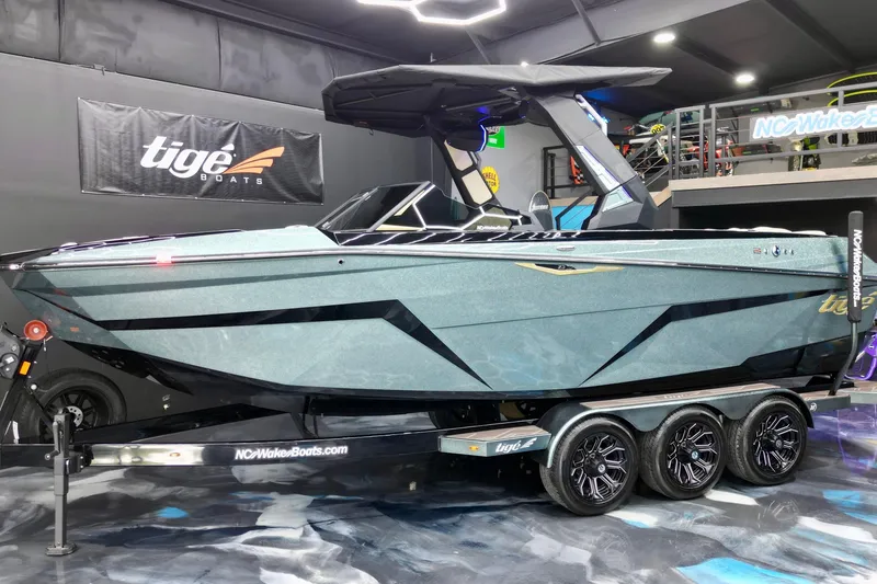 Slide: The Image of 2026 Tigé Z3 boat on display in showroom with sleek design and modern features. - 4