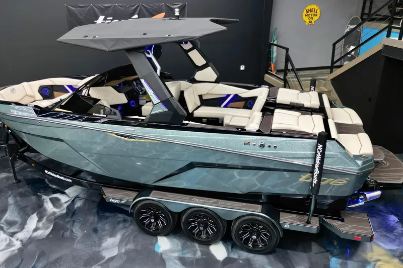 Slide: The Image of 2026 Tigé Z3 boat with sleek design and luxurious interior on display. - 5